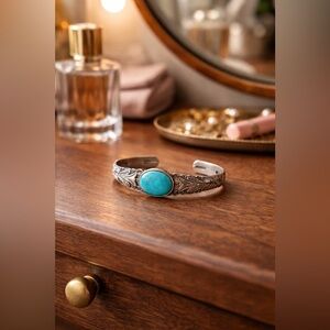 Southwestern Silver plate, turquoise stone centre, open cuff, carved pattern.